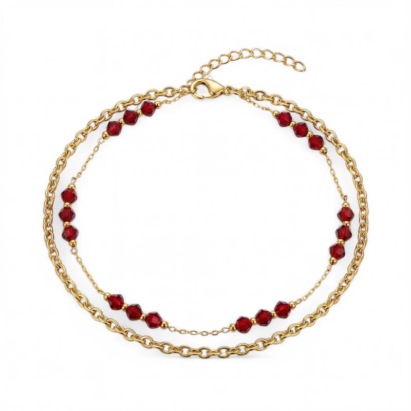 A luxurious gold anklet crafted from rust-resistant stainless steel, featuring a double-layered design adorned with colorful red beads. Combining elegance and vibrancy! Includes an adjustable clasp. - Image 1